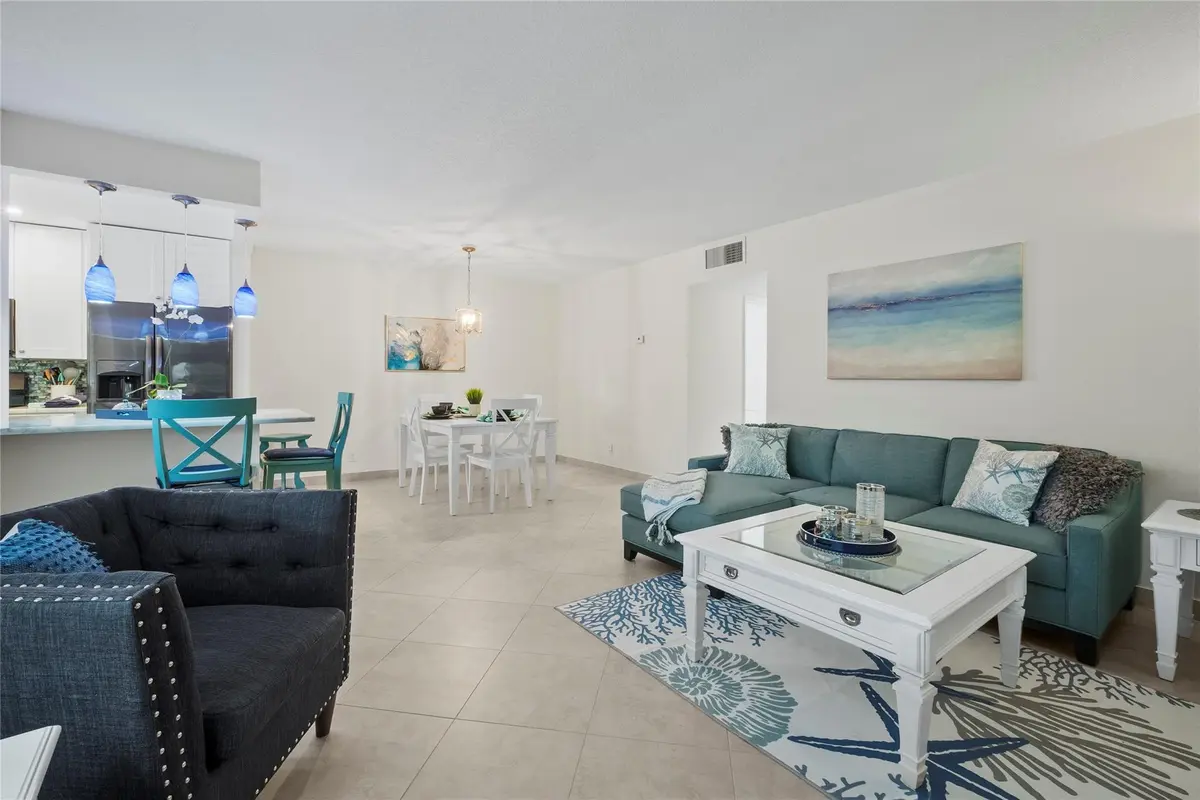 Living room dining room area at 1340 NE 28TH Avenue 242, Pompano Beach
