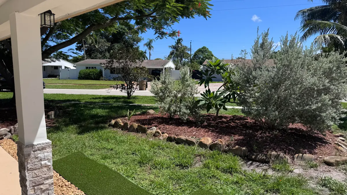Corner lot front yard at 13 SW 13th Street, Deerfield Beach