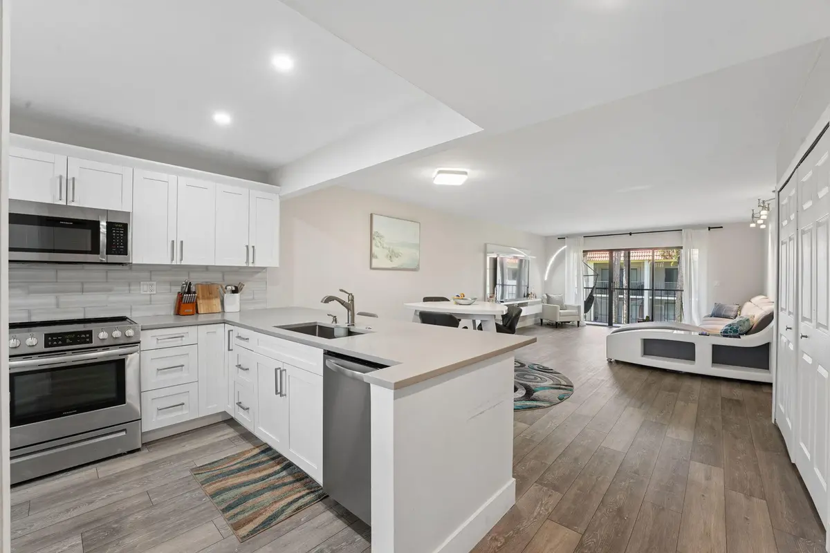 Kitchen and living room at 327 LAKEVIEW Drive 203, Weston