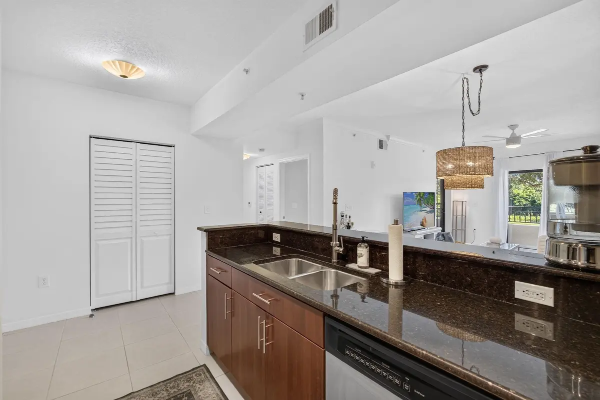 Kitchen and Laundry Closet at 4905 Midtown Lane 2211, Palm Beach Gardens