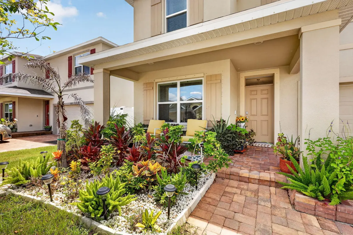 Covered front porch & garden at 9517 Silver Sands Lane, Fort Pierce