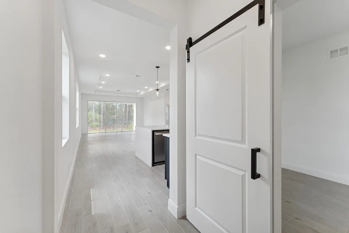 Foyer & Home Office with Barn Doors at 5942 Hammock Dl Way 58, Port St. Lucie