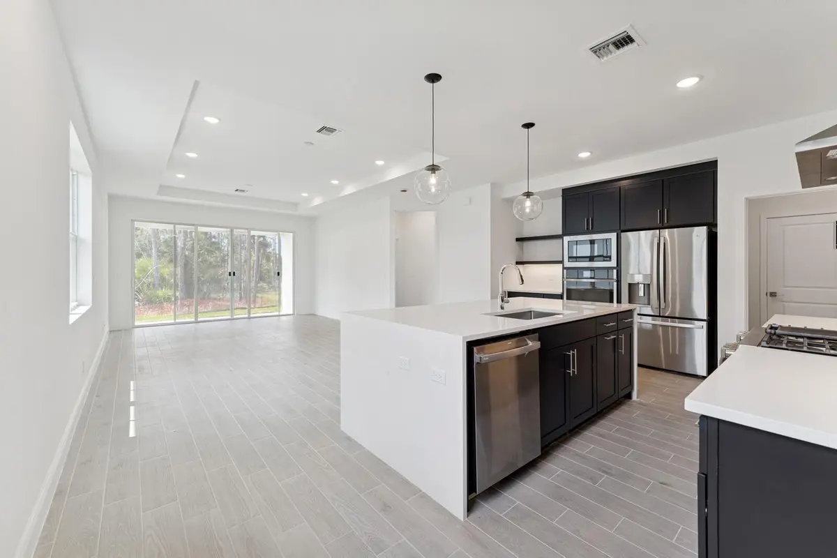 Kitchen, Dining Area and Great Room at 5942 Hammock Dl Way 58, Port St. Lucie