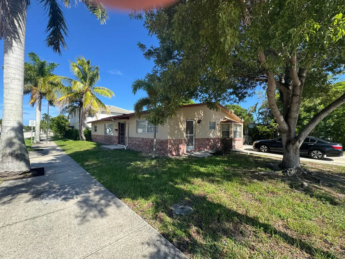 FRONT AND SIDE VIEW at 704 E HILLSBORO Boulevard, Deerfield Beach