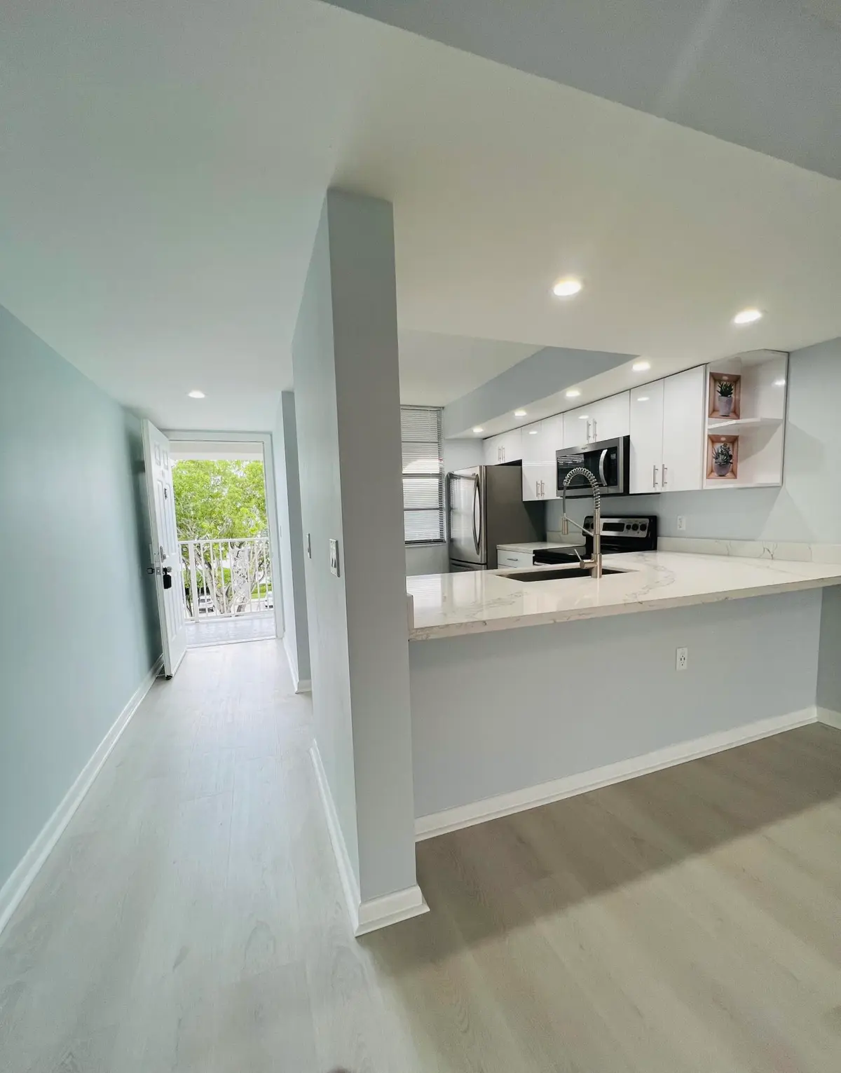 Entrance & kitchen at 3635 Whitehall Drive 404, West Palm Beach