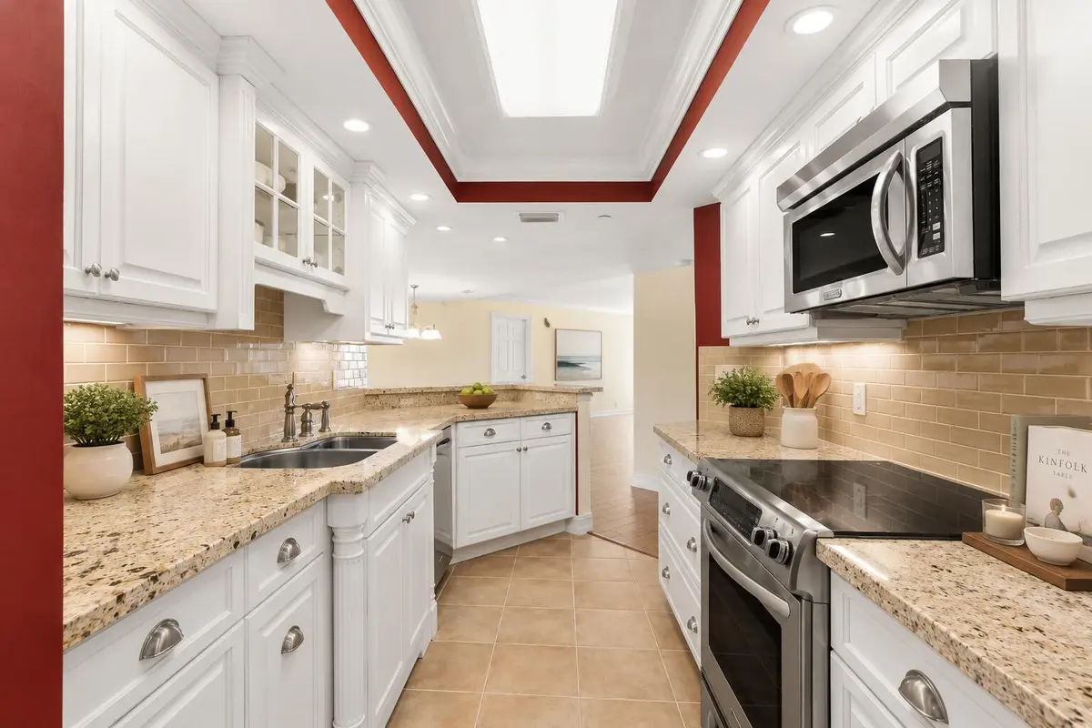 tiara-15c-granite-kitchen-white-cabinetr at 3000 N Ocean Drive 15C, Singer Island