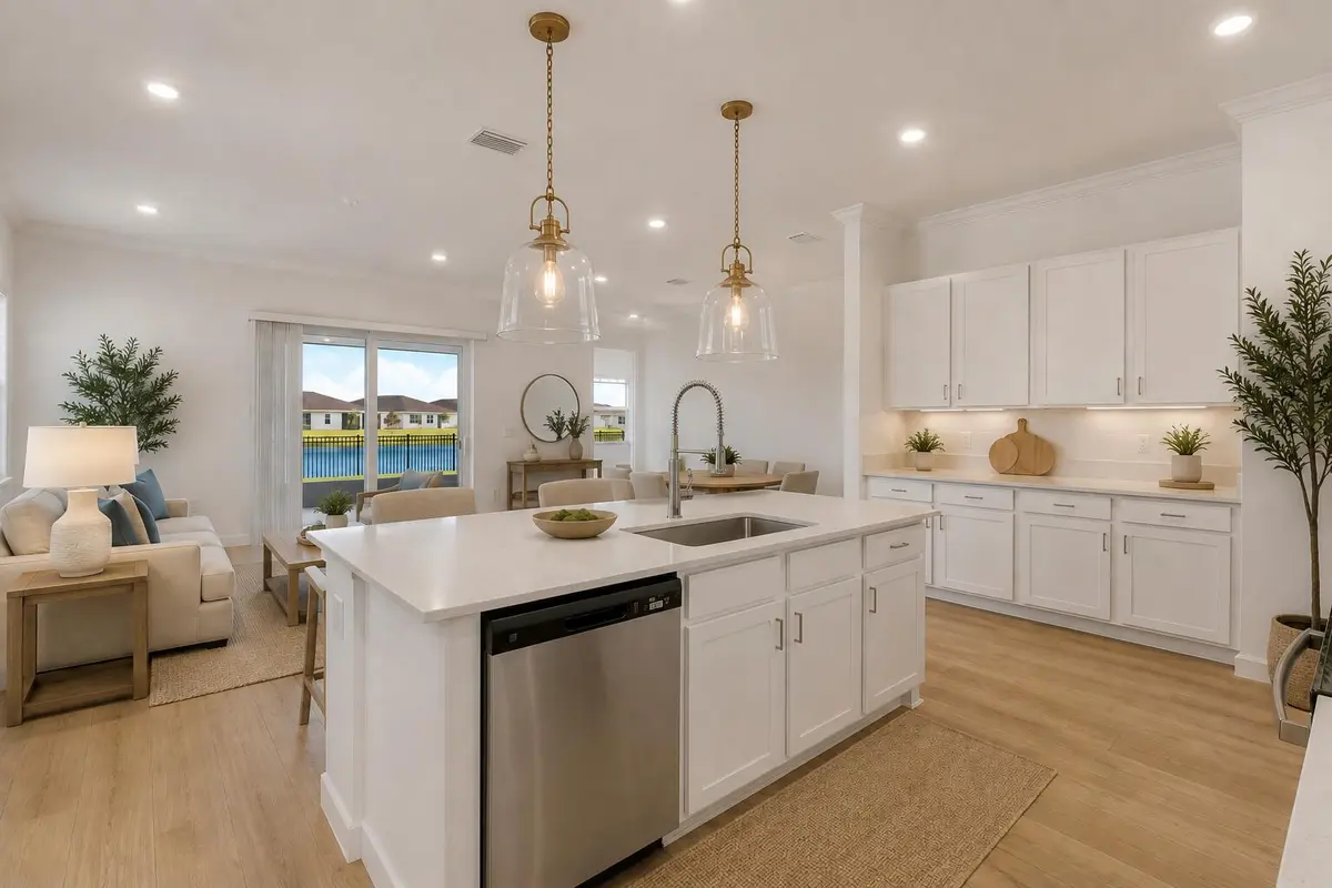 Kitchen angle with Great room background at 1113 SE CROSSWOOD Way, Port St. Lucie