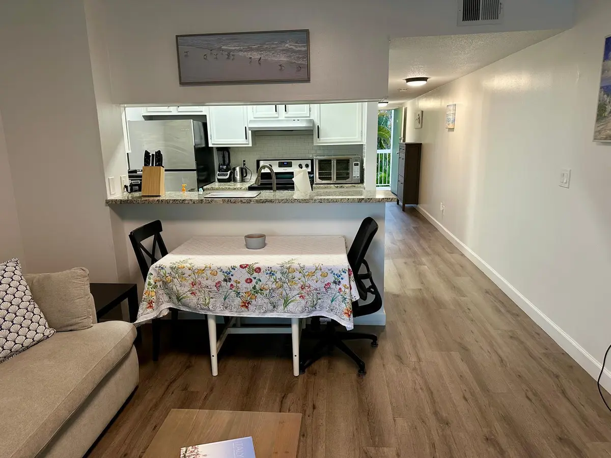 253 Cypress living room-kitchen at 253 CYPRESS POINT Drive, Palm Beach Gardens