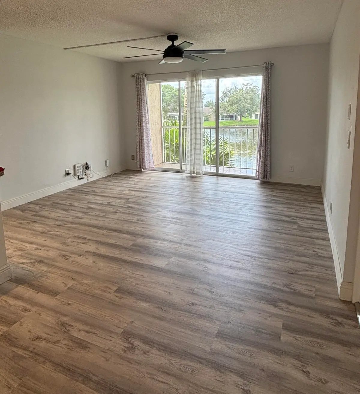 Large living area with sliders at 13771 ONEIDA Drive G2, Delray Beach