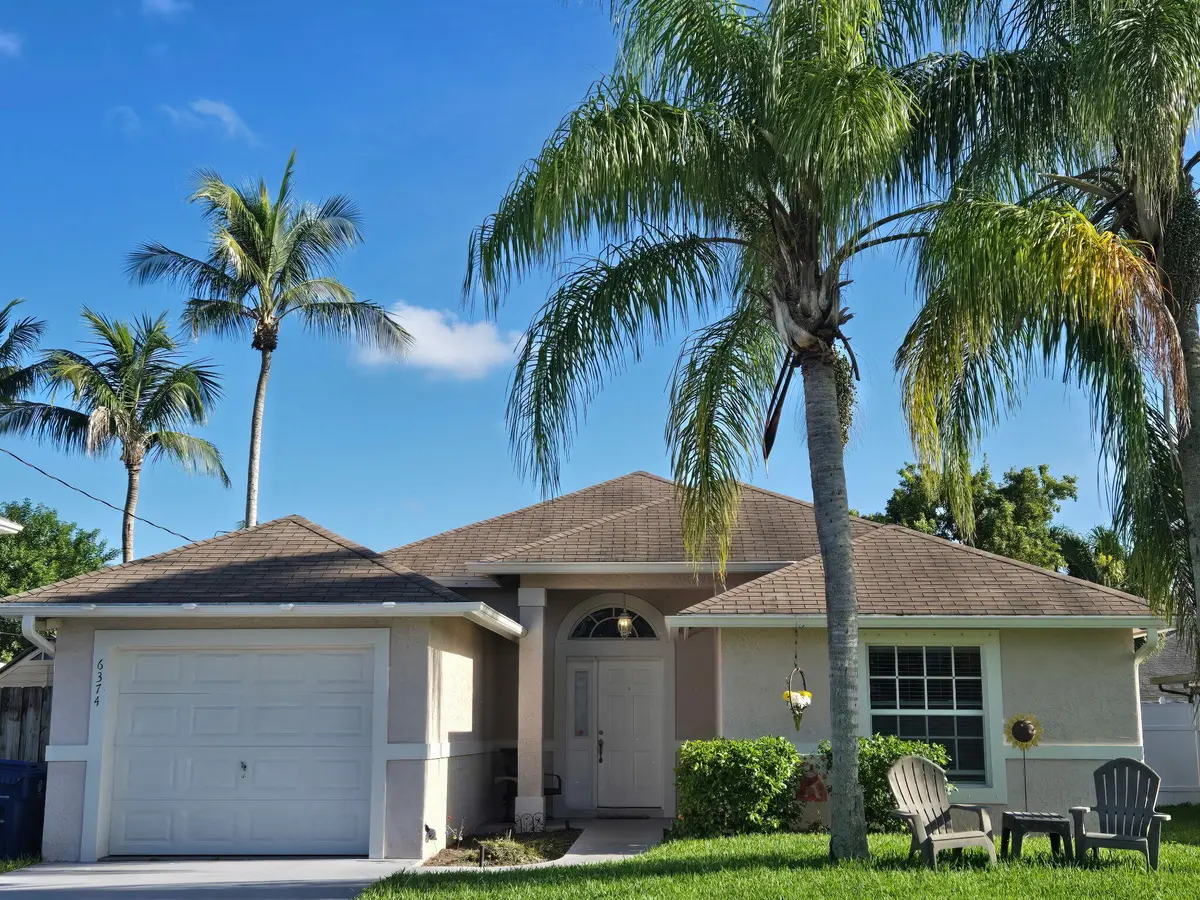 Front full garage at 6374 Robinson Street, Jupiter