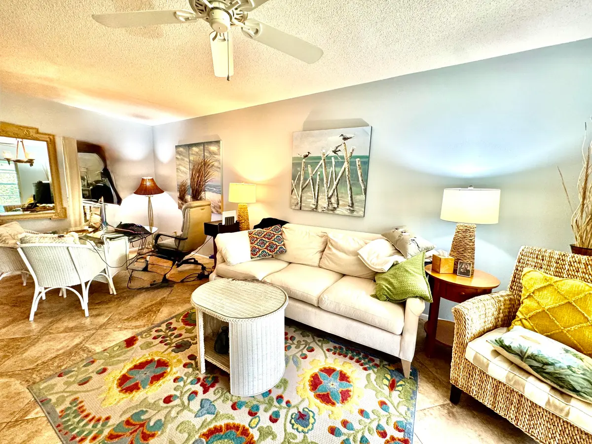 Living Room-Dining 1 at 1100 PONCE DE LEON Circle E306, Vero Beach