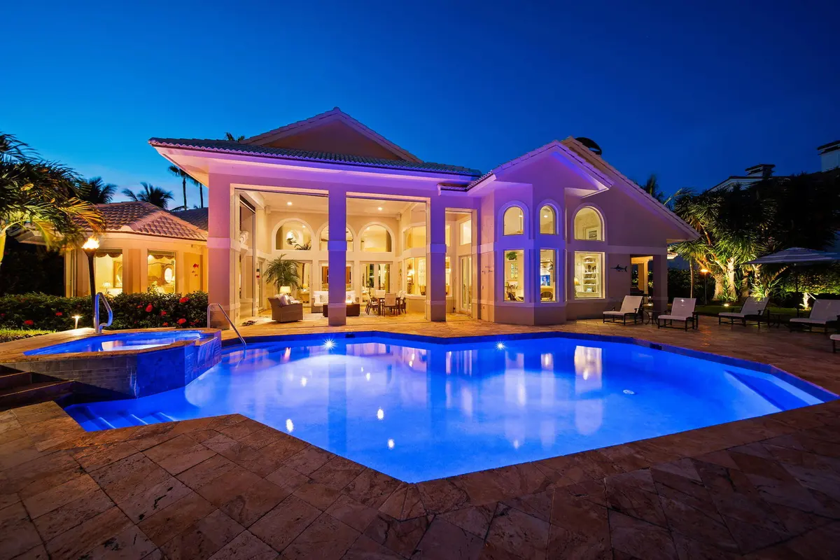 pool after dark at 6854 SE Isle Way, Stuart