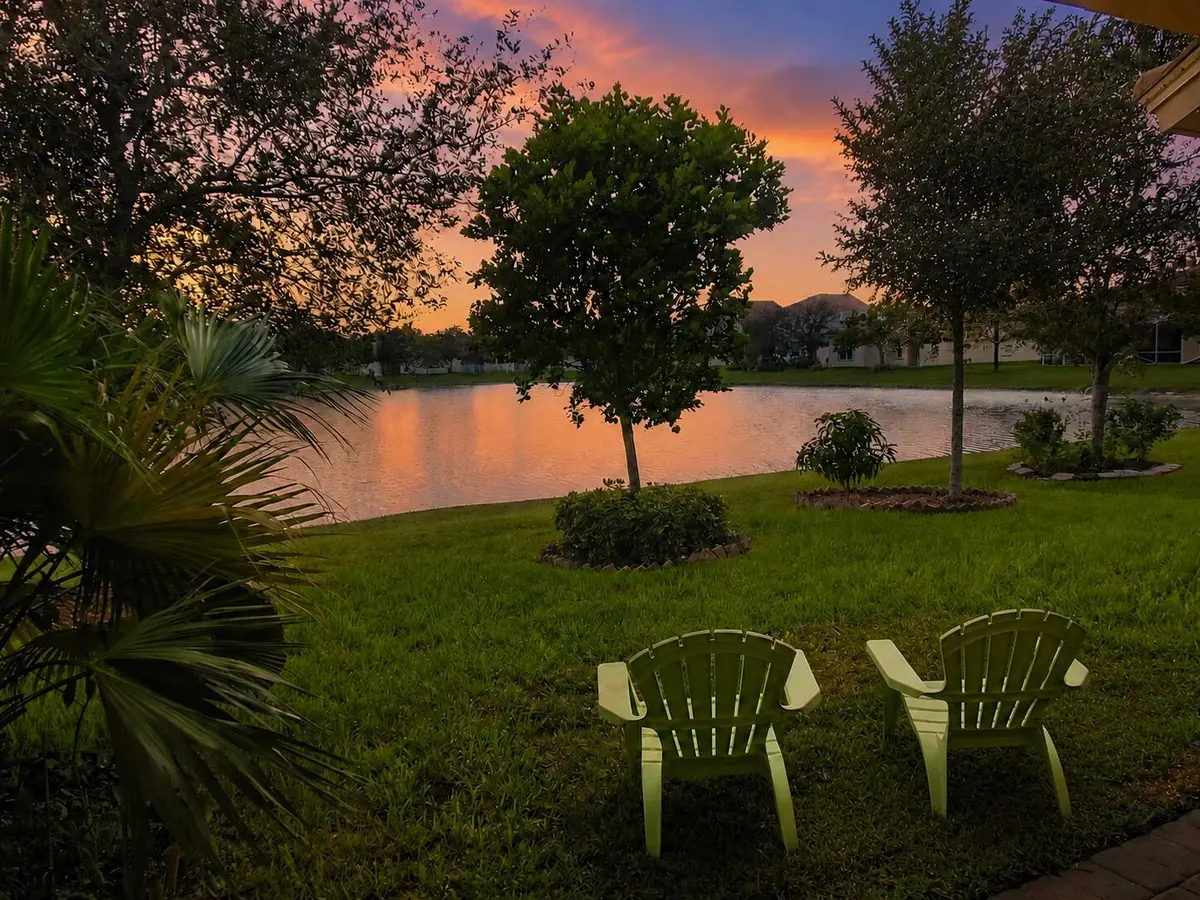 Twilight lakefront retreat with twin cha at 168 Belle Grove Lane, West Palm Beach