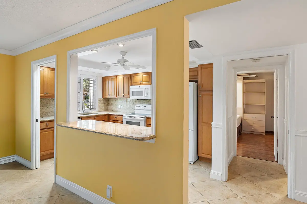 Kitchen Pass Through to Great Room at 375 Beach Road 201, Tequesta
