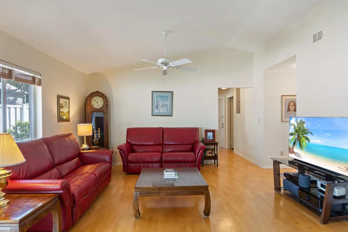 9822 red couch and wall and tv at 9822 NW 2nd Court, Plantation