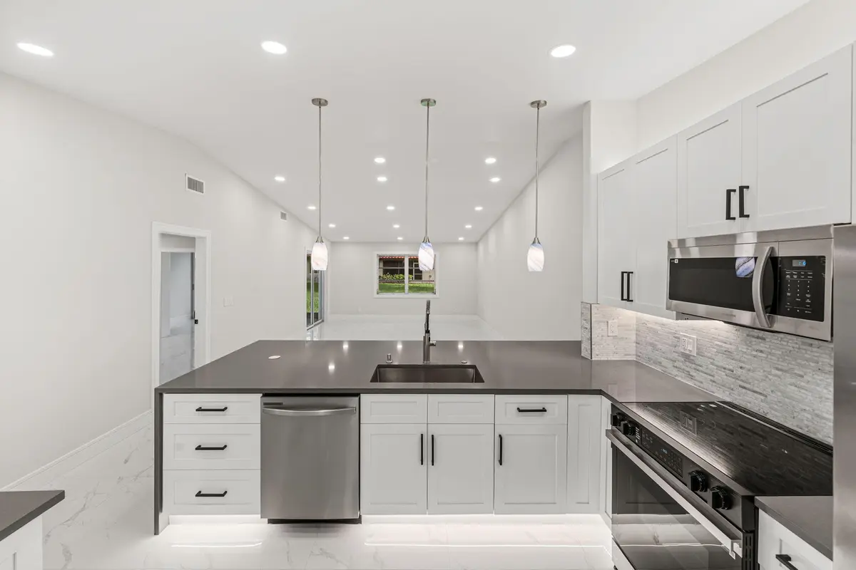 1 Kitchen - Back to Laundry Room at 6083 MILLINGTON Way, Delray Beach