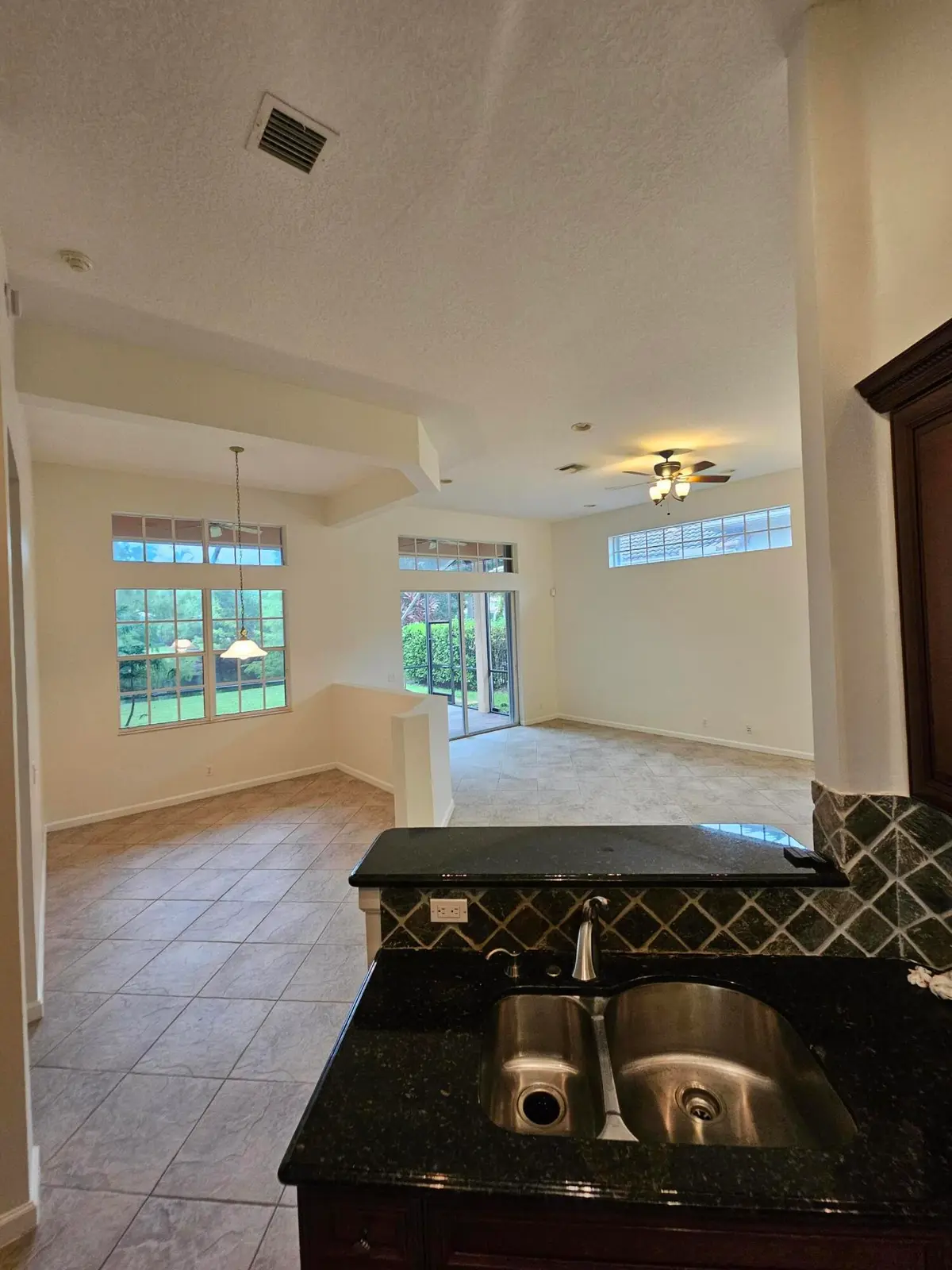 FAMILY ROOM VIEW FROM KITCHEN at 121 PALMFIELD Way, Jupiter