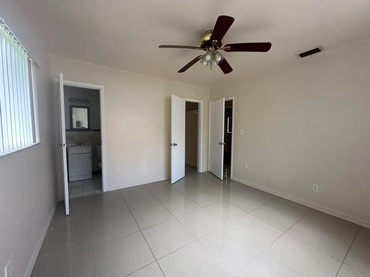 Primary bedroom with bathroom at 1316 NW 15th Place, Fort Lauderdale