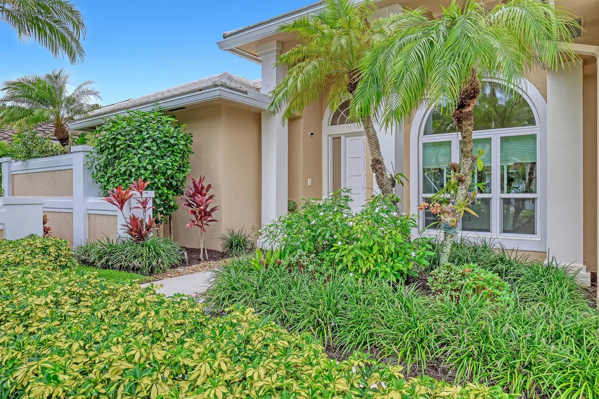 Landscaped Front Ent w/Impact Window at 23 Windward Isle, Palm Beach Gardens