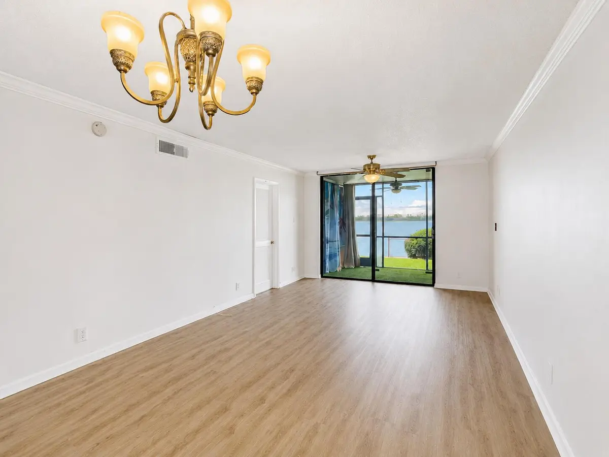 Dining - Living - Patio at 110 LAKE EMERALD Drive 103, Oakland Park