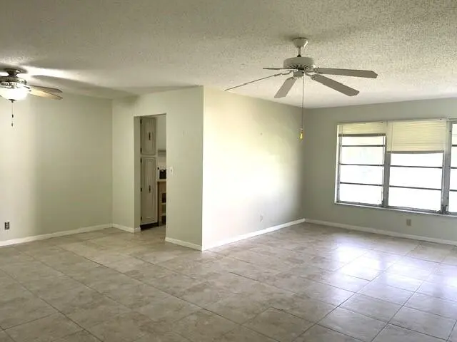 Dining kitchen and living room view at 892 HIGH POINT Boulevard B, Delray Beach