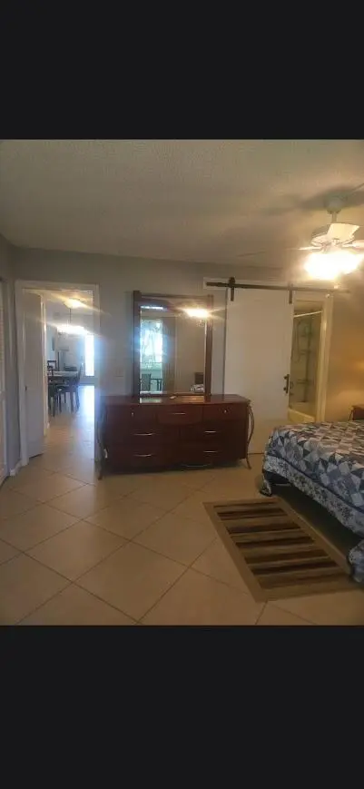 photo of bedroom from patio sliding door at 27 Newport B, Deerfield Beach
