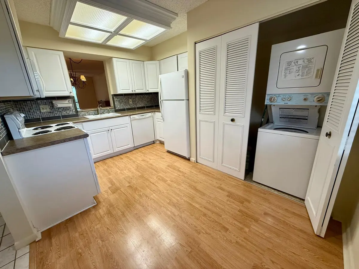 Kitchen with Washer/dryer at 2212 S CYPRESS BEND Drive 303, Pompano Beach