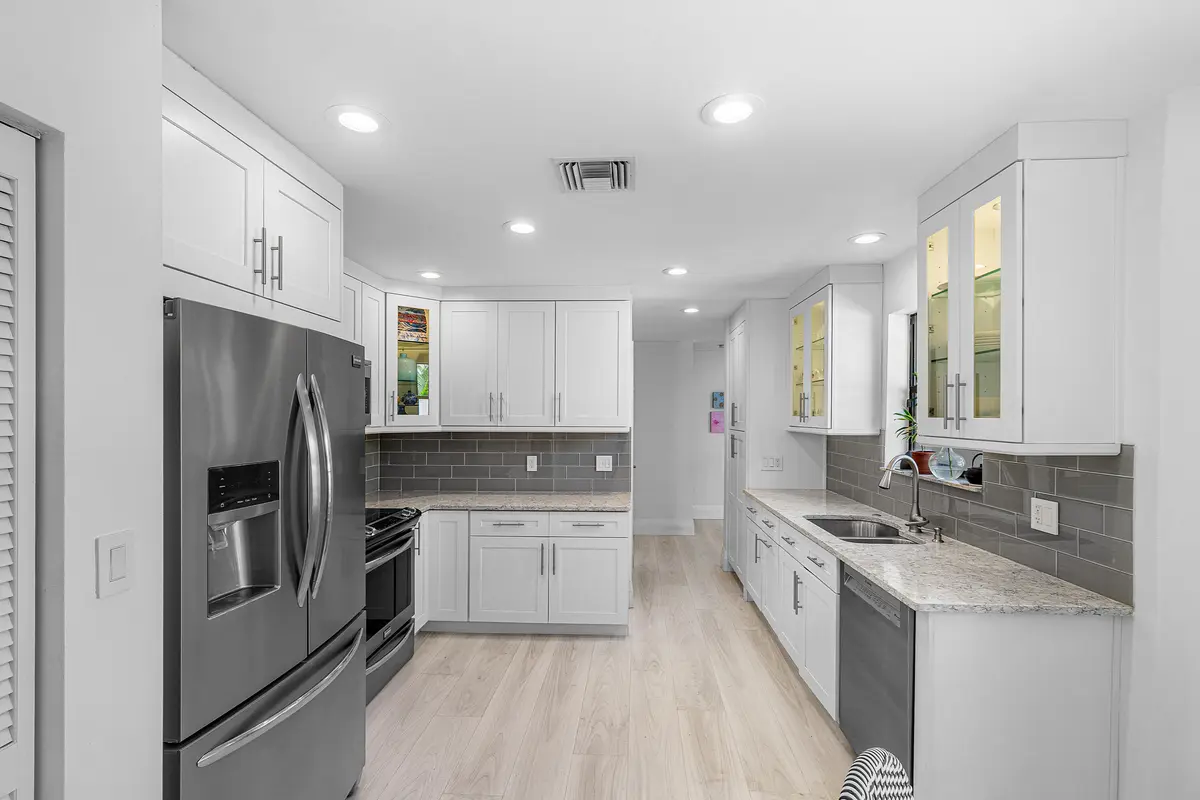 Kitchen with granite counters at 5315 Monterey Circle D, Delray Beach