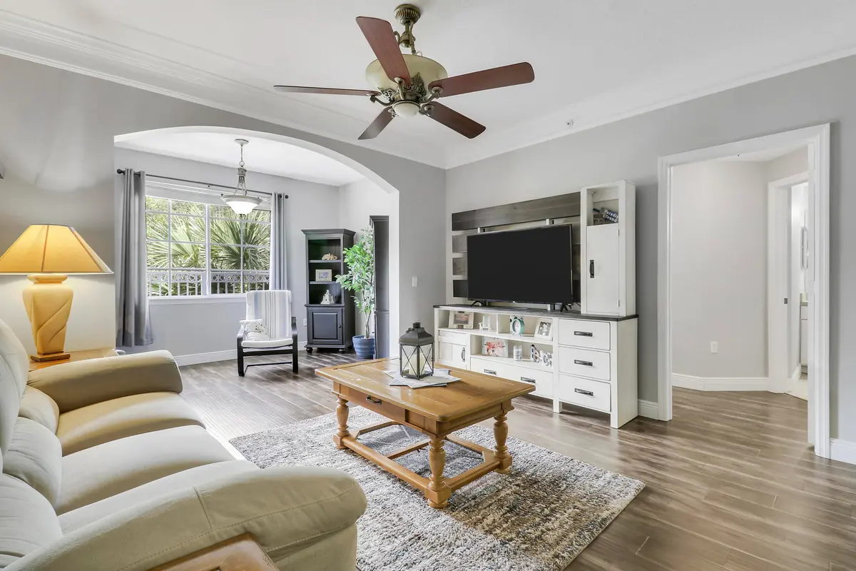 Living Room and Sunroom at 8303 MYRTLEWOOD Circle, Palm Beach Gardens