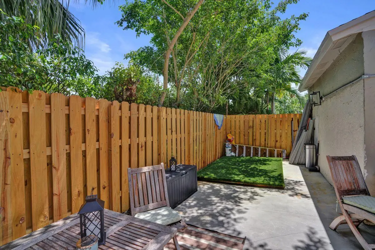 Front courtyard dog grass at 734 NW 132nd Terrace, Plantation