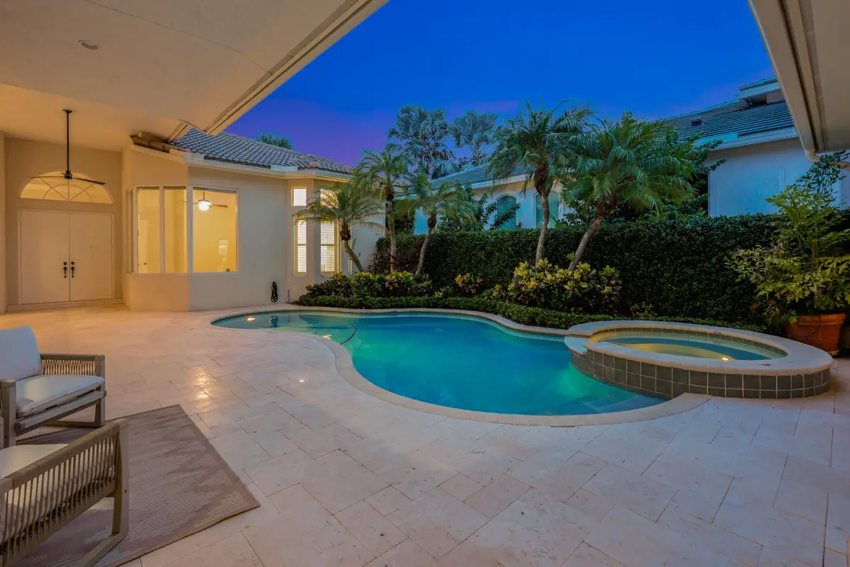 twighlight courtyardfront doors at 540 Les Jardin Drive, Palm Beach Gardens