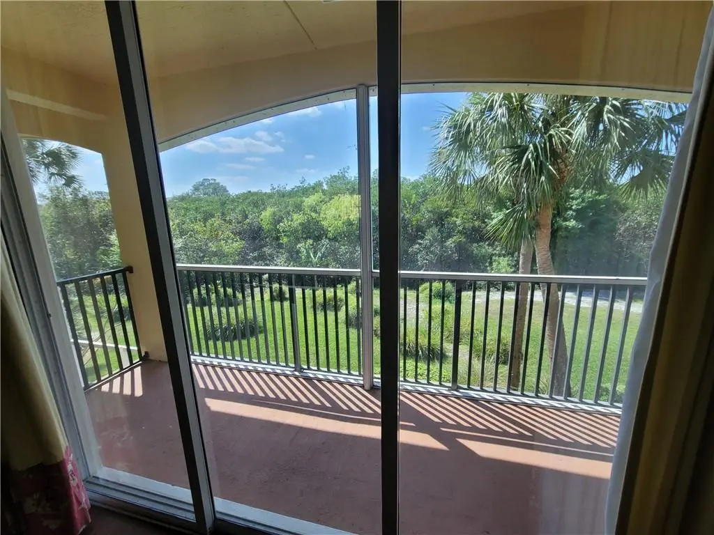 Bedroom 2 Balcony Screened at 2358 SW Island Creek Trail, Palm City