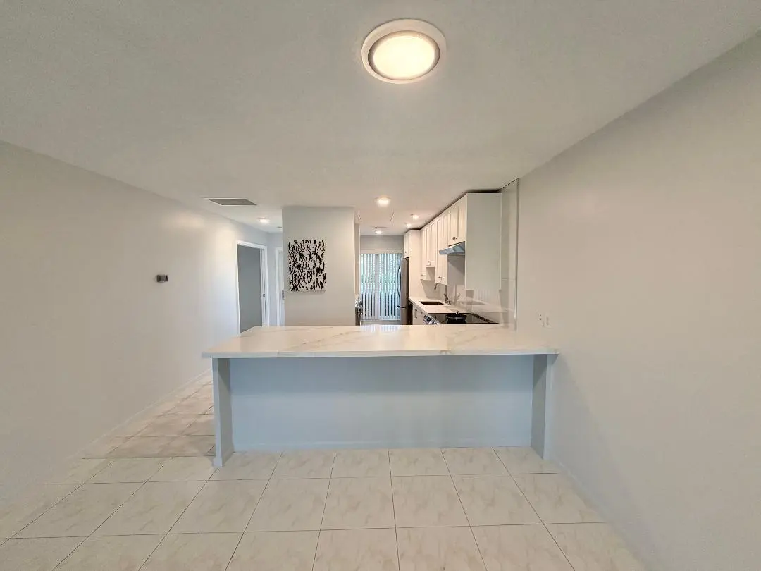 Dining area to kitchen at 1110 Cactus Terrace D, Delray Beach