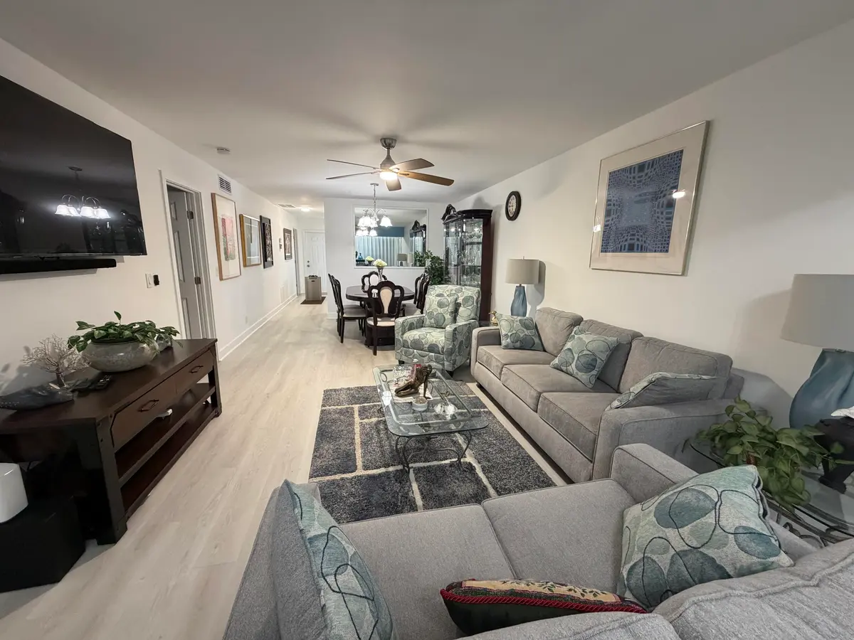 Living room to dining area at 1111 Lemon Tree Terrace 104, Delray Beach