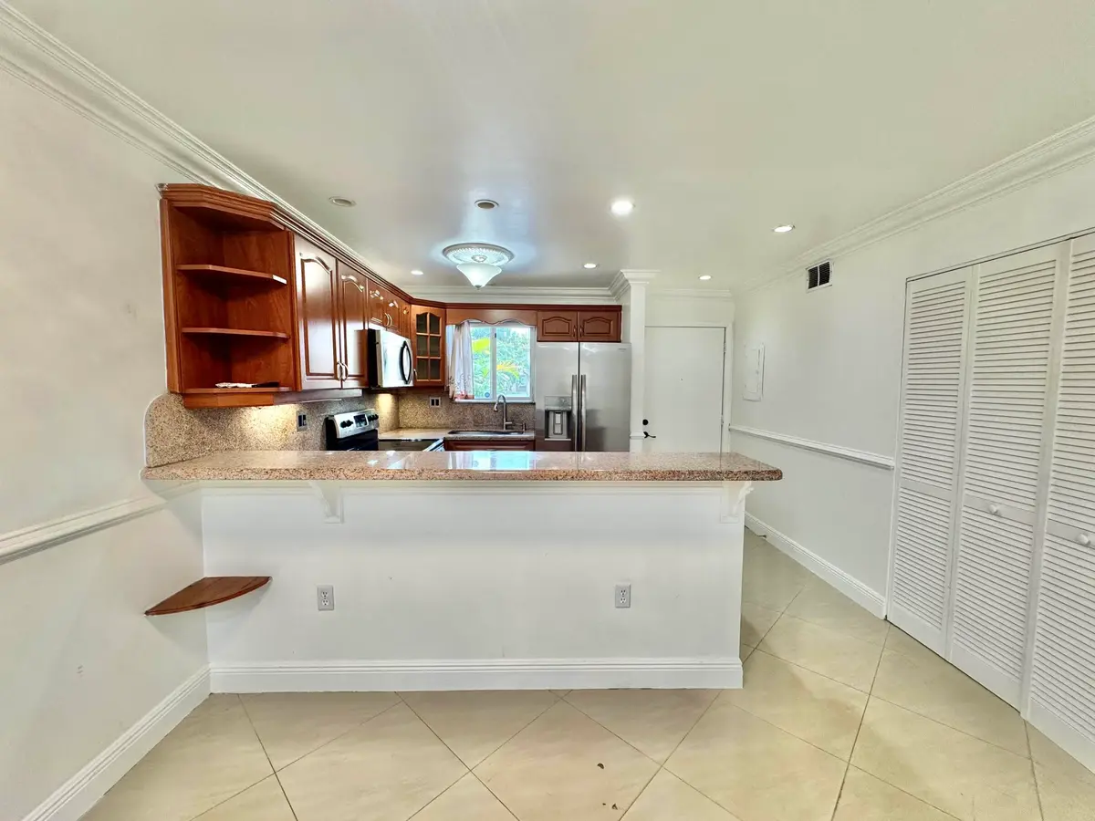 Open Kitchen and Living Room at 6074 FOREST HILL Boulevard 107, West Palm Beach
