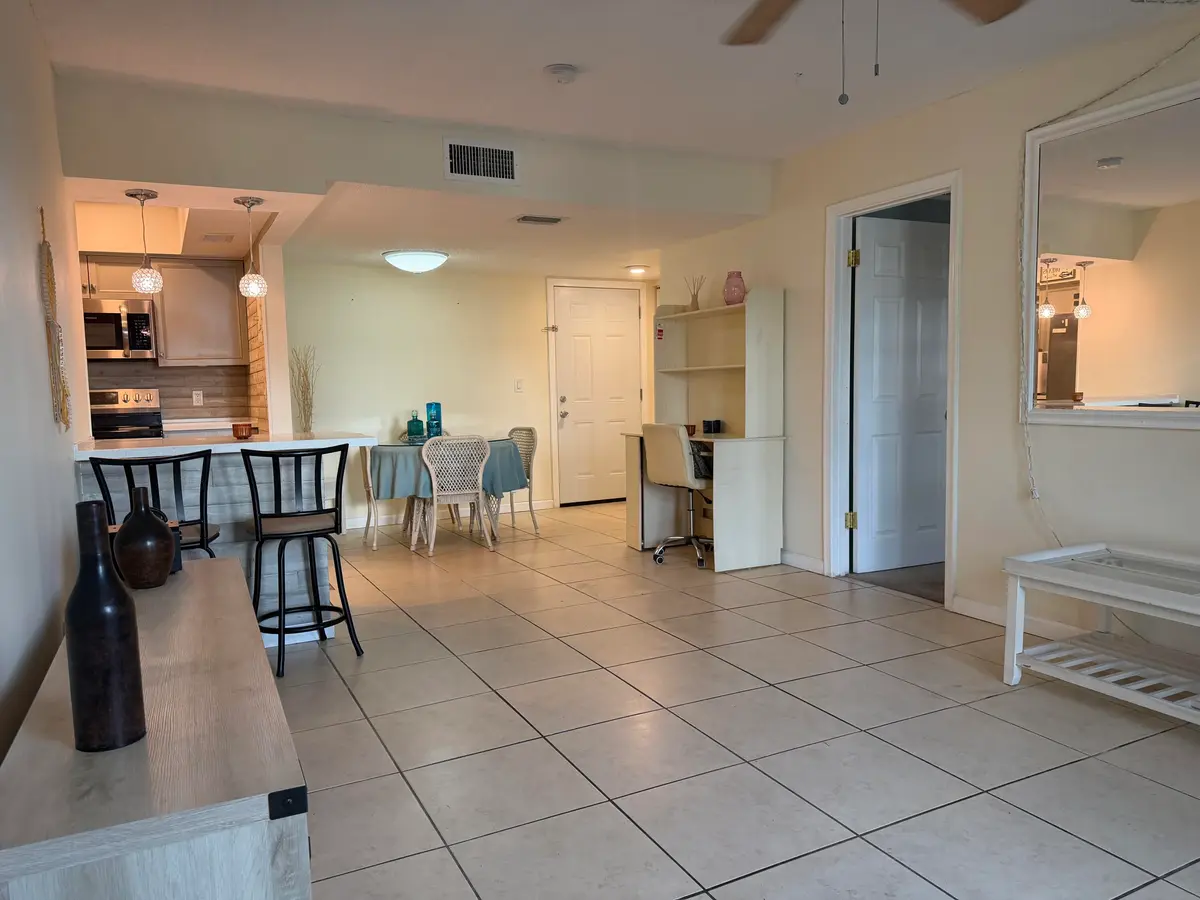 Living room looking toward the kitchen at 950 S Kanner Highway C 10, Stuart
