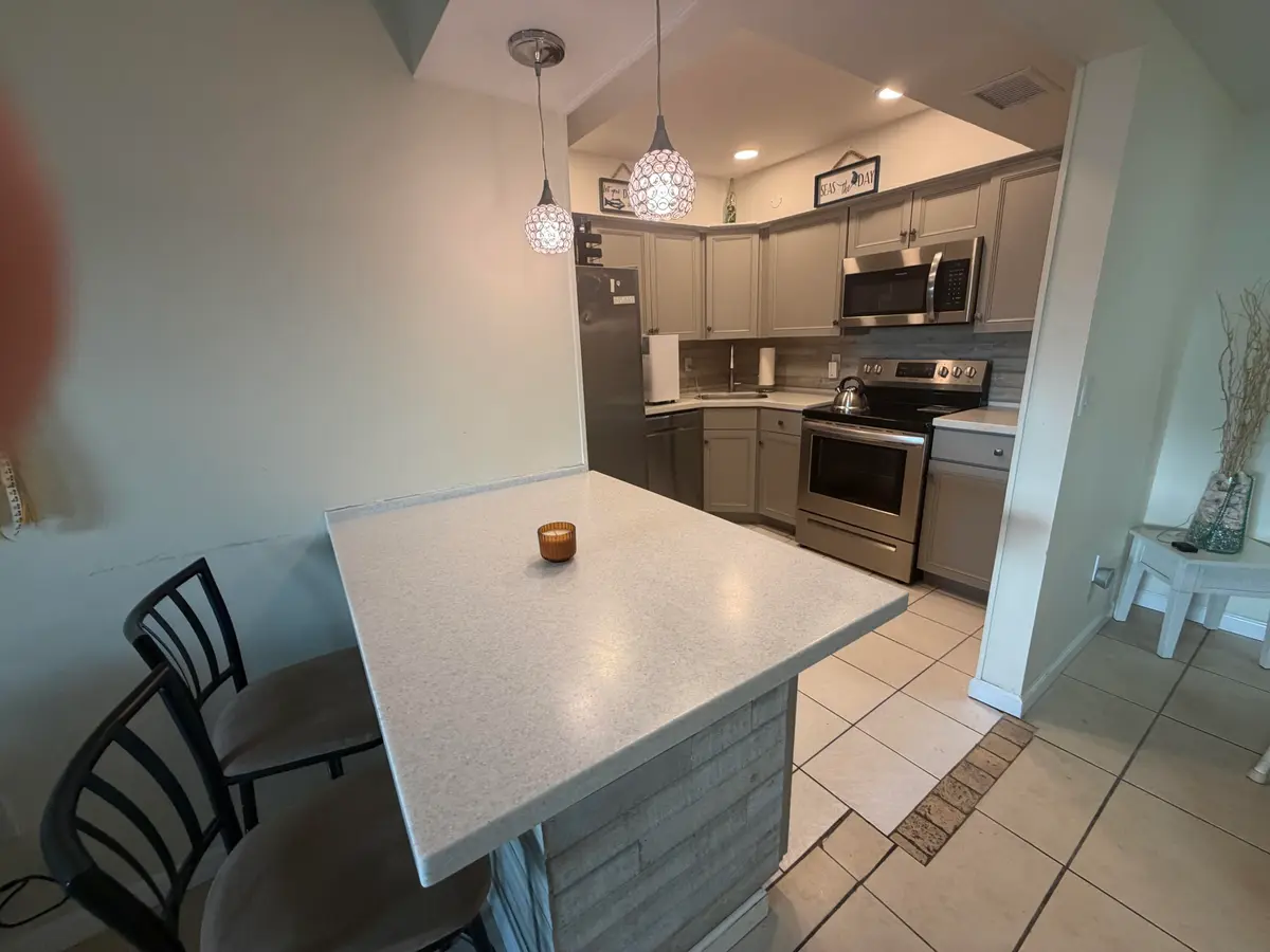 Kitchen and breakfast bar at 950 S Kanner Highway C 10, Stuart