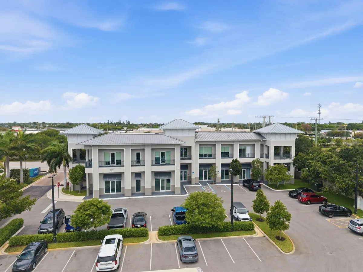 Exterior Mid aerial west facing centered at 1300 S Dixie Highway #112 - #114, Lantana