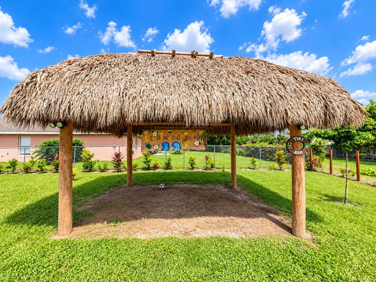 Colorful Backyard Tiki Bar Retreat at 1025 SW SARTO Lane, Port St. Lucie