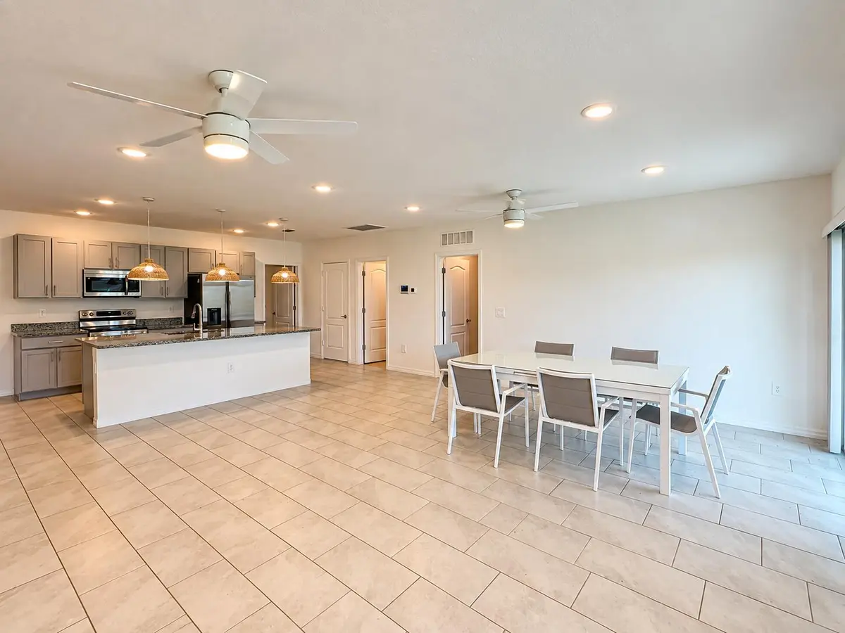 Modern Open-Plan Kitchen and Dining Area at 1025 SW SARTO Lane, Port St. Lucie