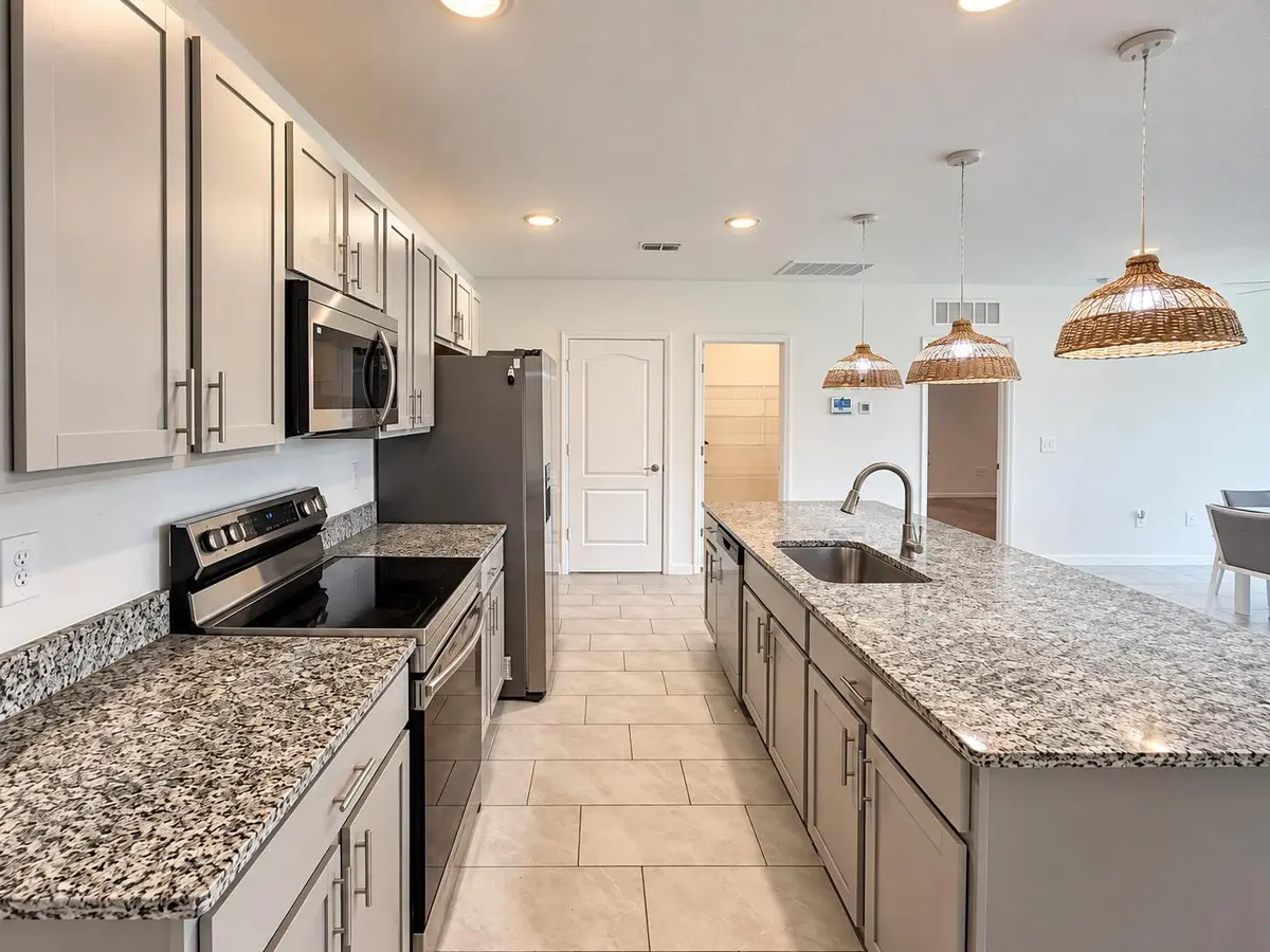Bright Modern Kitchen with Wicker Pendan at 1025 SW SARTO Lane, Port St. Lucie