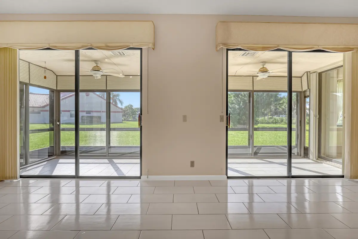 Double doors to the enclosed patio at 7744 Lexington Club Boulevard, Delray Beach