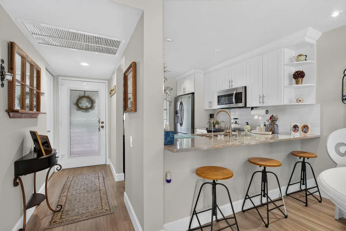 DINING RM TO KITCHEN at 1211 BAHAMA Bend F2, Coconut Creek