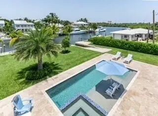 Heated Salt Water Pool with Sun Shelf at 205 Body Court, Jupiter