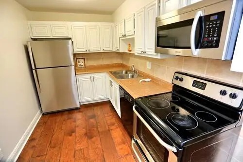 Kitchen with updated appliances at 1428 SE 4TH Avenue 270, Deerfield Beach