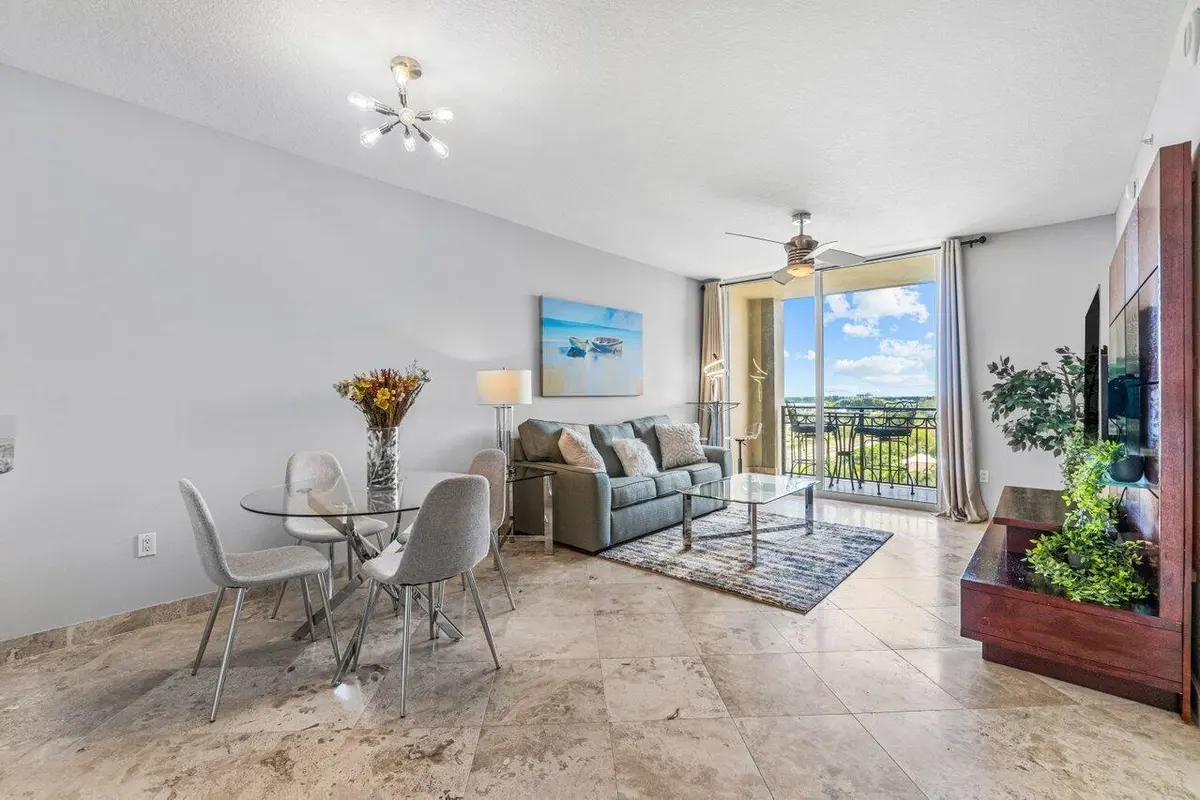 Living / Dining Areas & Covered Balcony at 550 Okeechobee Boulevard 824, West Palm Beach