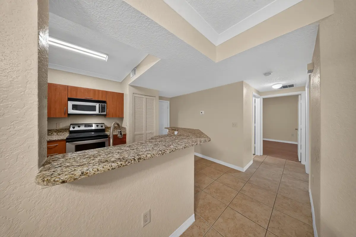6 kitchen-hall at 150 SW PEACOCK Boulevard 26-102, Port St. Lucie