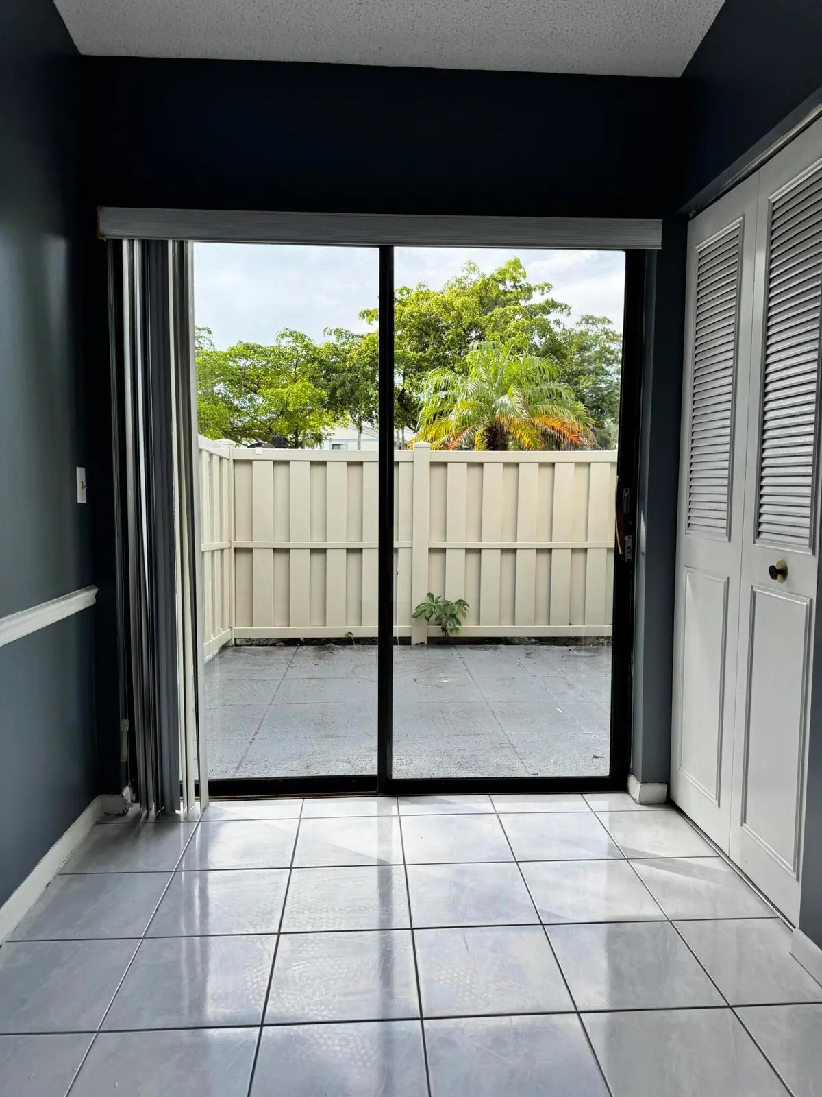 Kitchen to courtyard view at 1025 Green Pine Boulevard B, West Palm Beach