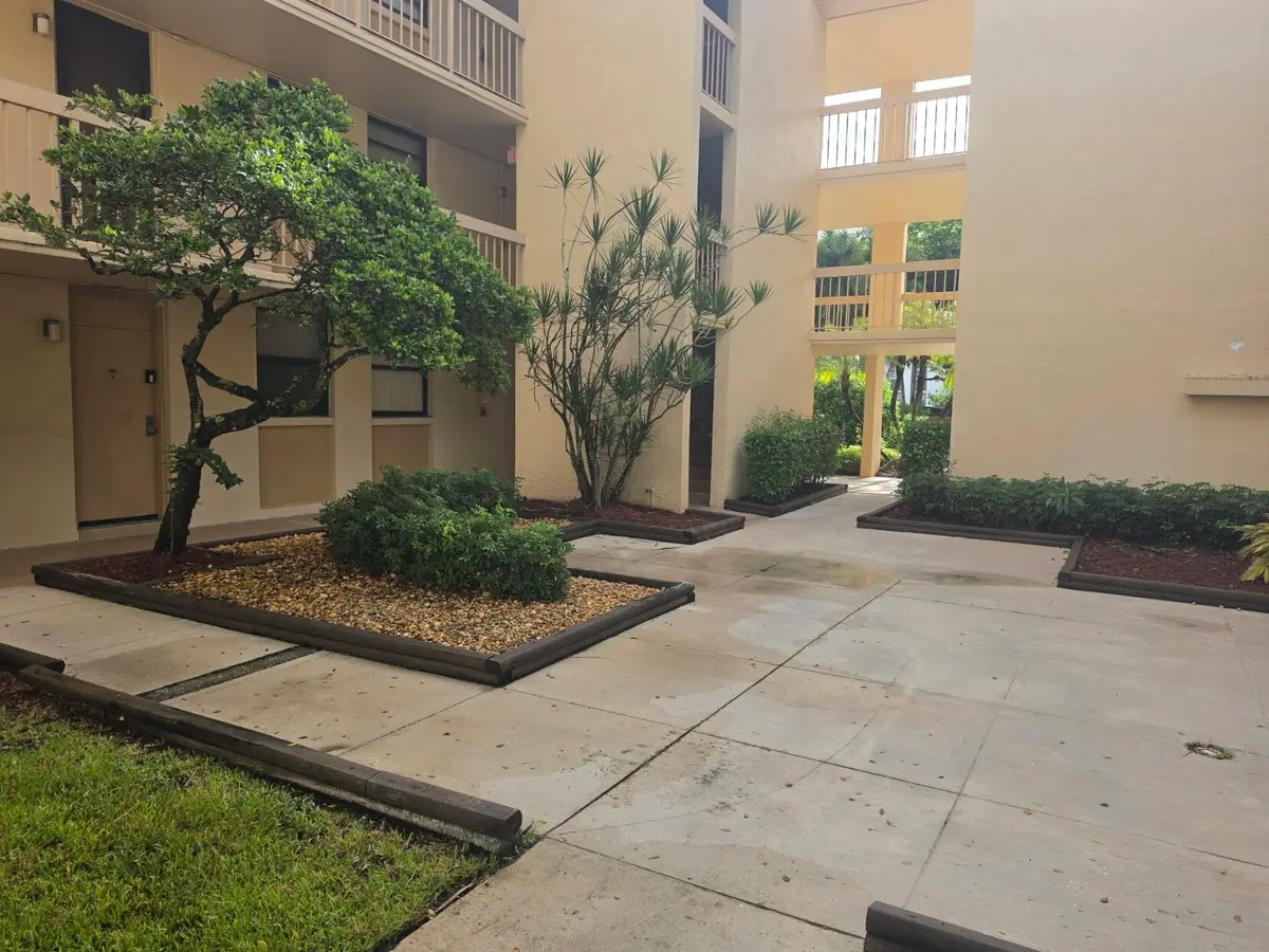 COURTYARD ENTRANCE GREENGLADES at 8425 Forest Hills Drive 205, Coral Springs