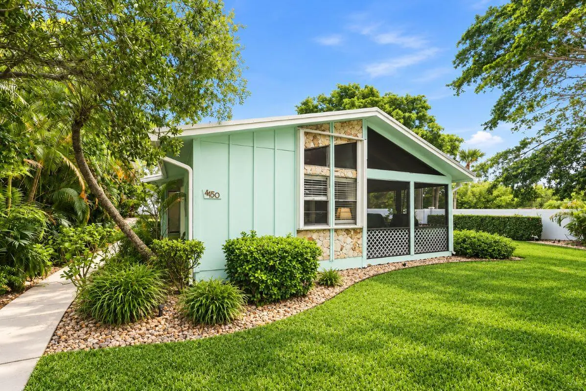 East Face lawn with Sidewalk at 4150 NE Breakwater Drive, Jensen Beach